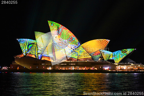 Image of Opera house in summer colours of lime, aqua, yellow and orange
