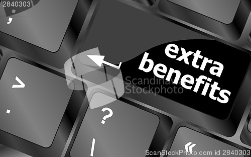 Image of extra benefits button on keyboard - business concept