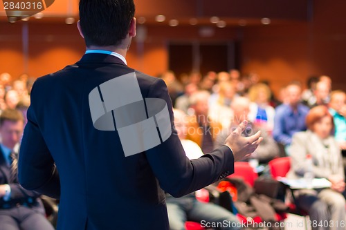 Image of Speaker at Business Conference and Presentation.