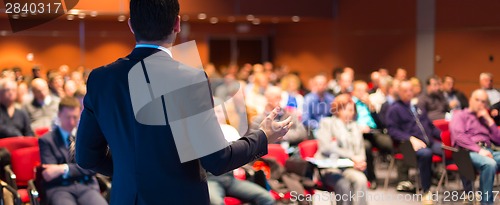 Image of Speaker at Business Conference and Presentation.