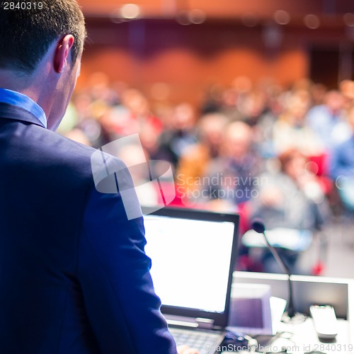 Image of Speaker at Business Conference and Presentation.