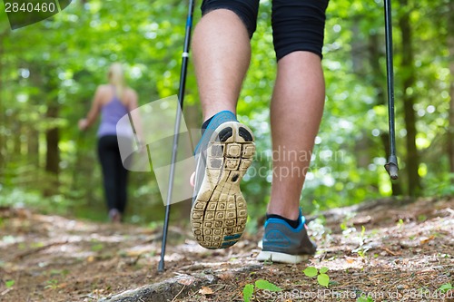 Image of Young couple hiking in nature. Sport and exercise.