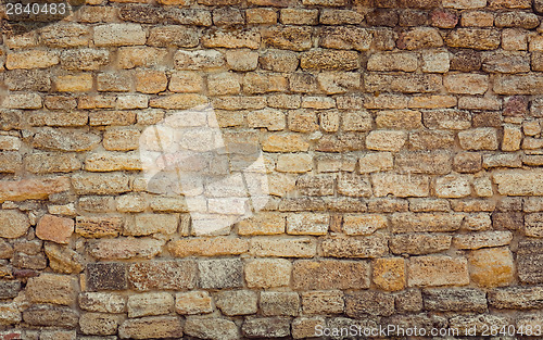 Image of Old Wall Constructed Of Stone Bricks.