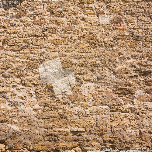 Image of Old Wall Constructed Of Stone Bricks.