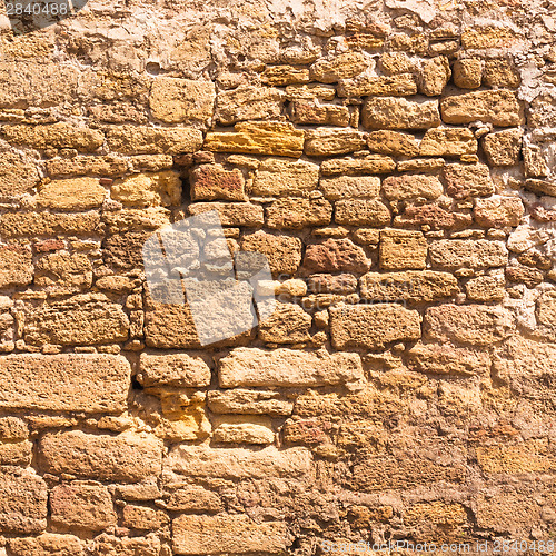 Image of Old Wall Constructed Of Stone Bricks.