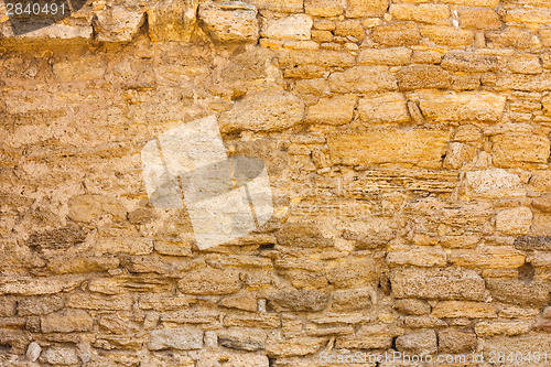 Image of Old Wall Constructed Of Stone Bricks.