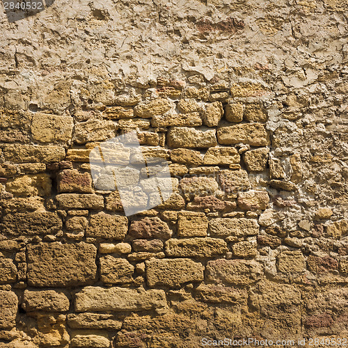 Image of Old Wall Constructed Of Stone Bricks.