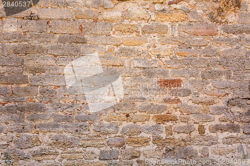 Image of Old Wall Constructed Of Stone Bricks.