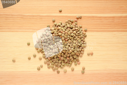 Image of Green lentils on wood