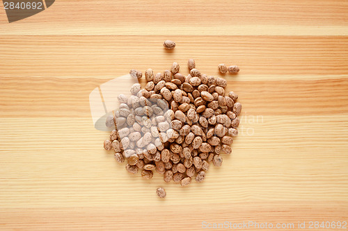 Image of Pinto beans on wood