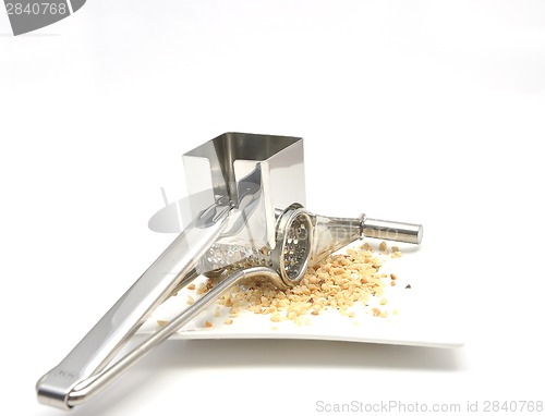Image of Grater with hazelnuts