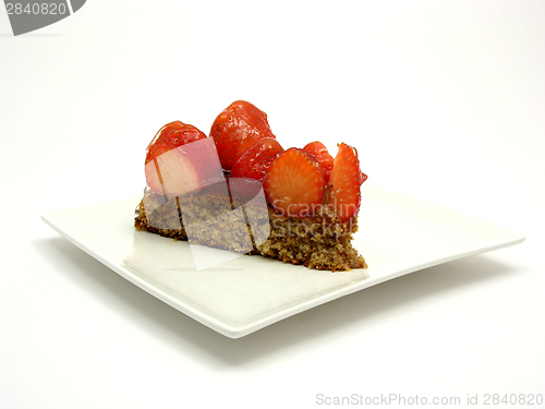 Image of One slice of strawberry cake on white plate on white background