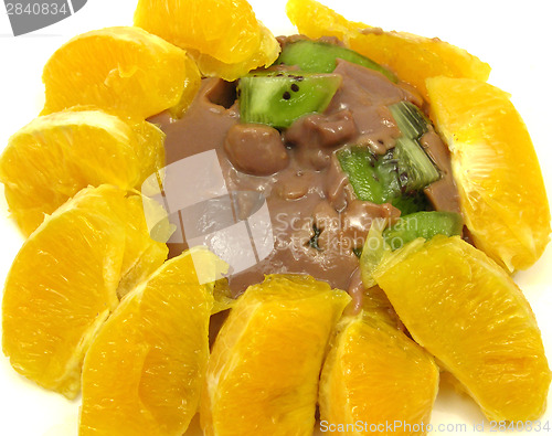 Image of Chocolate pudding with kiwi fruit and orange
