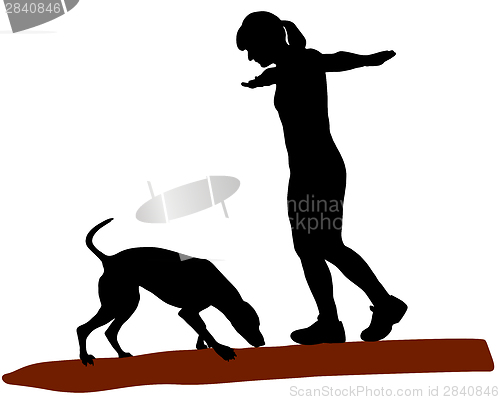 Image of Woman and dog on log