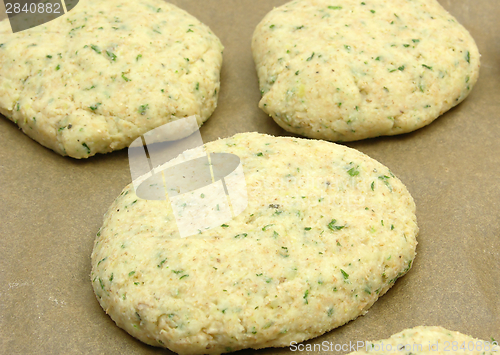 Image of Potato herbs burger on a baking tray