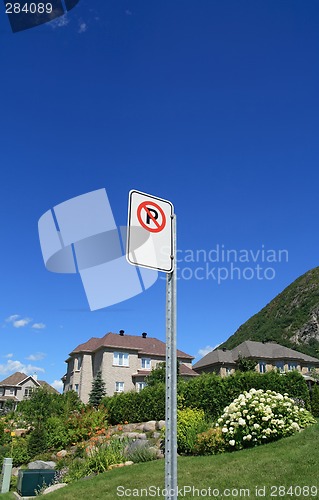 Image of No parking sign in a rich suburban neighborhood