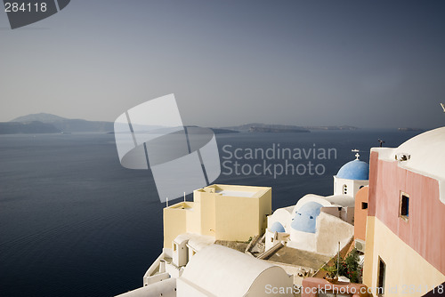 Image of church and residences over sea santorini