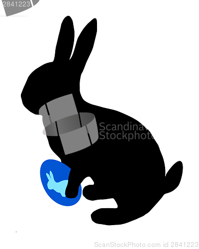 Image of The black silhouette of a easter bunny with easter egg