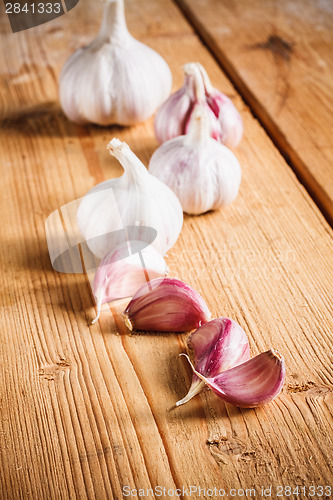 Image of Raw Garlic On Wooden Background