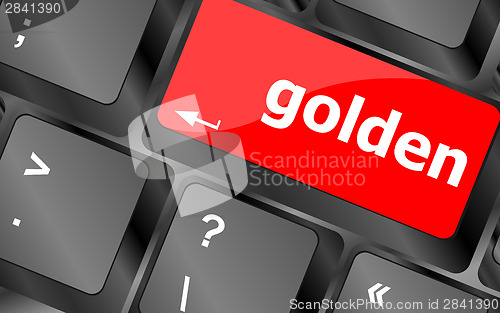 Image of golden word on keyboard key, notebook computer button