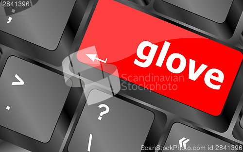 Image of glove word on keyboard key, notebook computer button