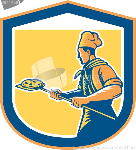 Image of Baker Pizza Maker Holding Peel Pizza Shield 