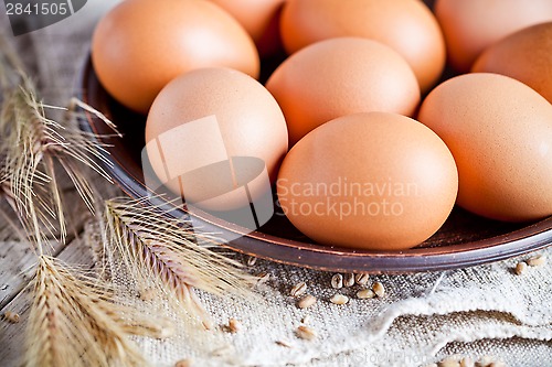 Image of fresh brown eggs on a plate