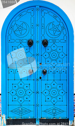 Image of Traditional blue arched door from Sidi Bou Said in Tunisia