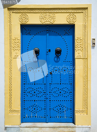 Image of Blue door with ornament from Sidi Bou Said in Tunisia