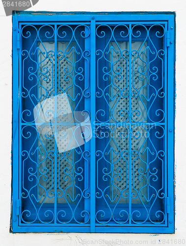 Image of Traditional blue window from Sidi Bou Said in Tunisia