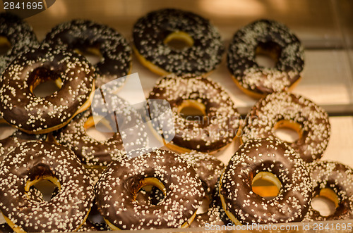 Image of delicious donut with chocolate icing and sprinkles 