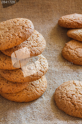 Image of Stacked Brown Cookies On Rustic Background