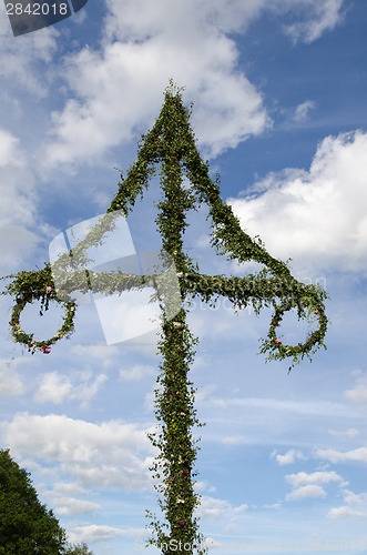 Image of Midsummer pole at blue sky with white clouds