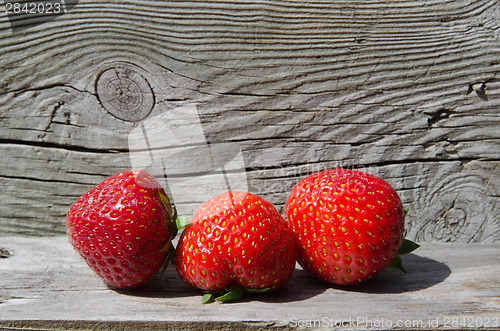 Image of Strawberries at wooden background