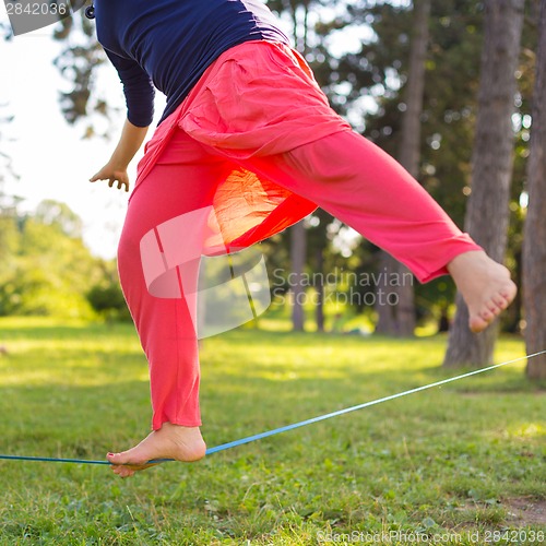 Image of Slack line in the city park.