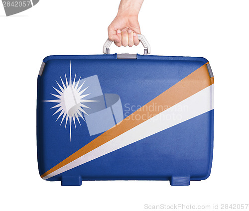 Image of Used plastic suitcase with stains and scratches