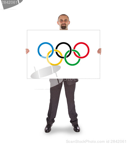 Image of Businessman holding a big card