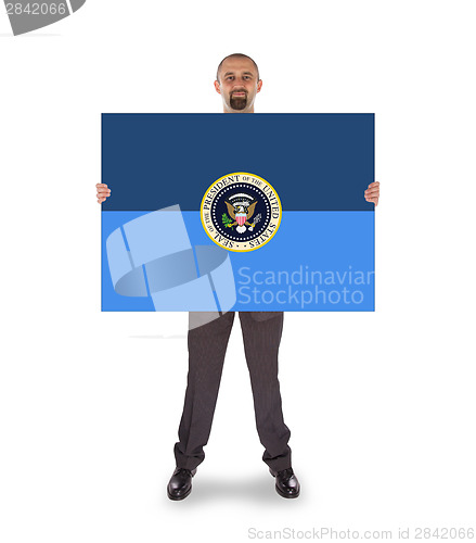 Image of Businessman holding a big card