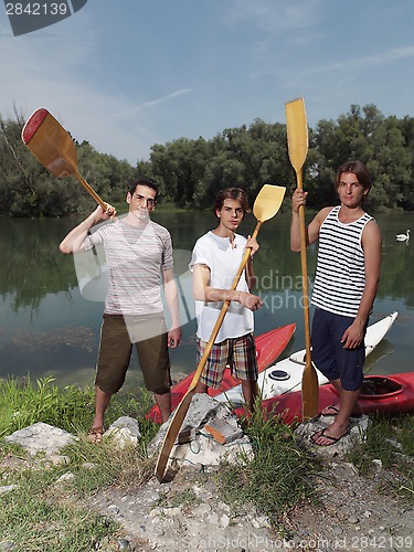 Image of Young men with kayaks