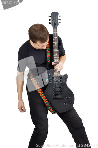 Image of Young man with electric guitar isolated on white background. Per