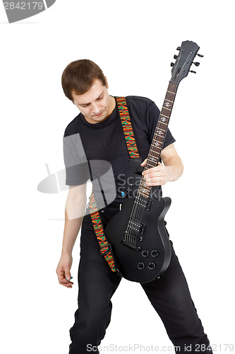 Image of Young man with electric guitar isolated on white background. Per