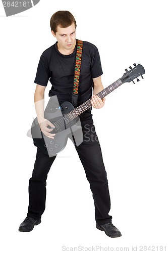 Image of Young man with electric guitar isolated on white background. Per