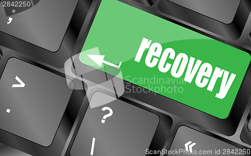 Image of key with recovery text on laptop keyboard button