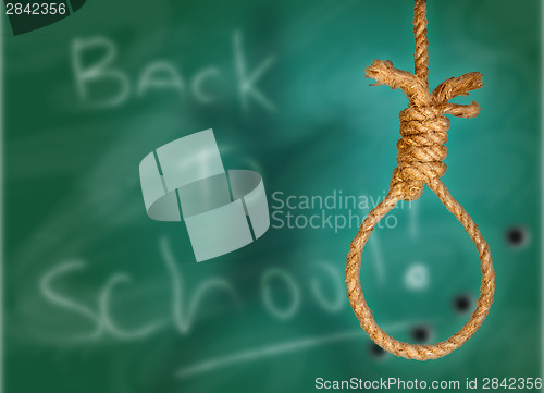 Image of Rope noose on green grunge black-board