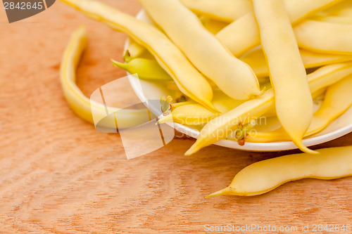 Image of Yellow Kidney Beans In A Bowl On Wooden Table