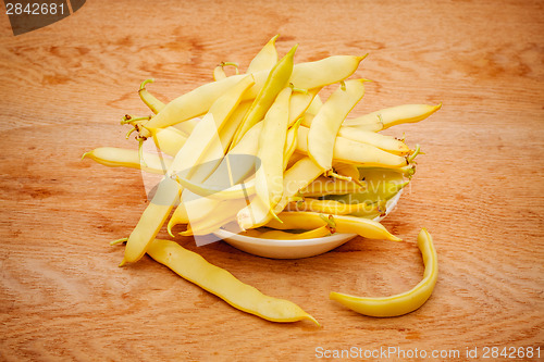 Image of Yellow Kidney Beans In A Bowl On Wooden Table