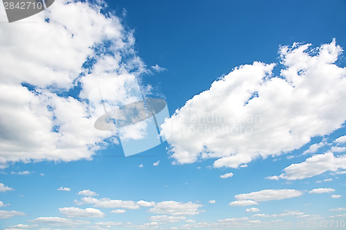 Image of Cumulus clouds in a bright blue sky.