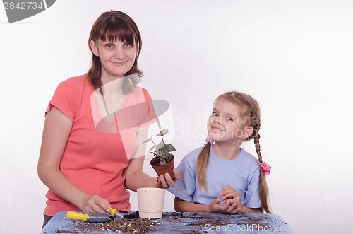 Image of Mom and daughter transplanted flower room