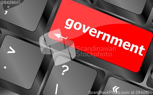 Image of government word on keyboard key, notebook computer button