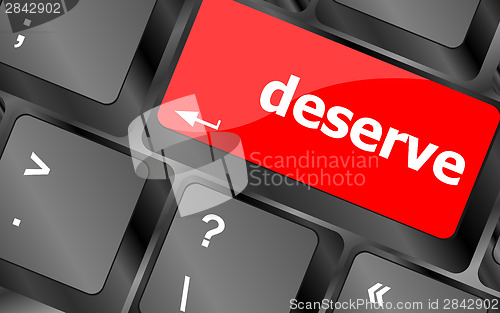 Image of deserve word on keyboard key, notebook computer button